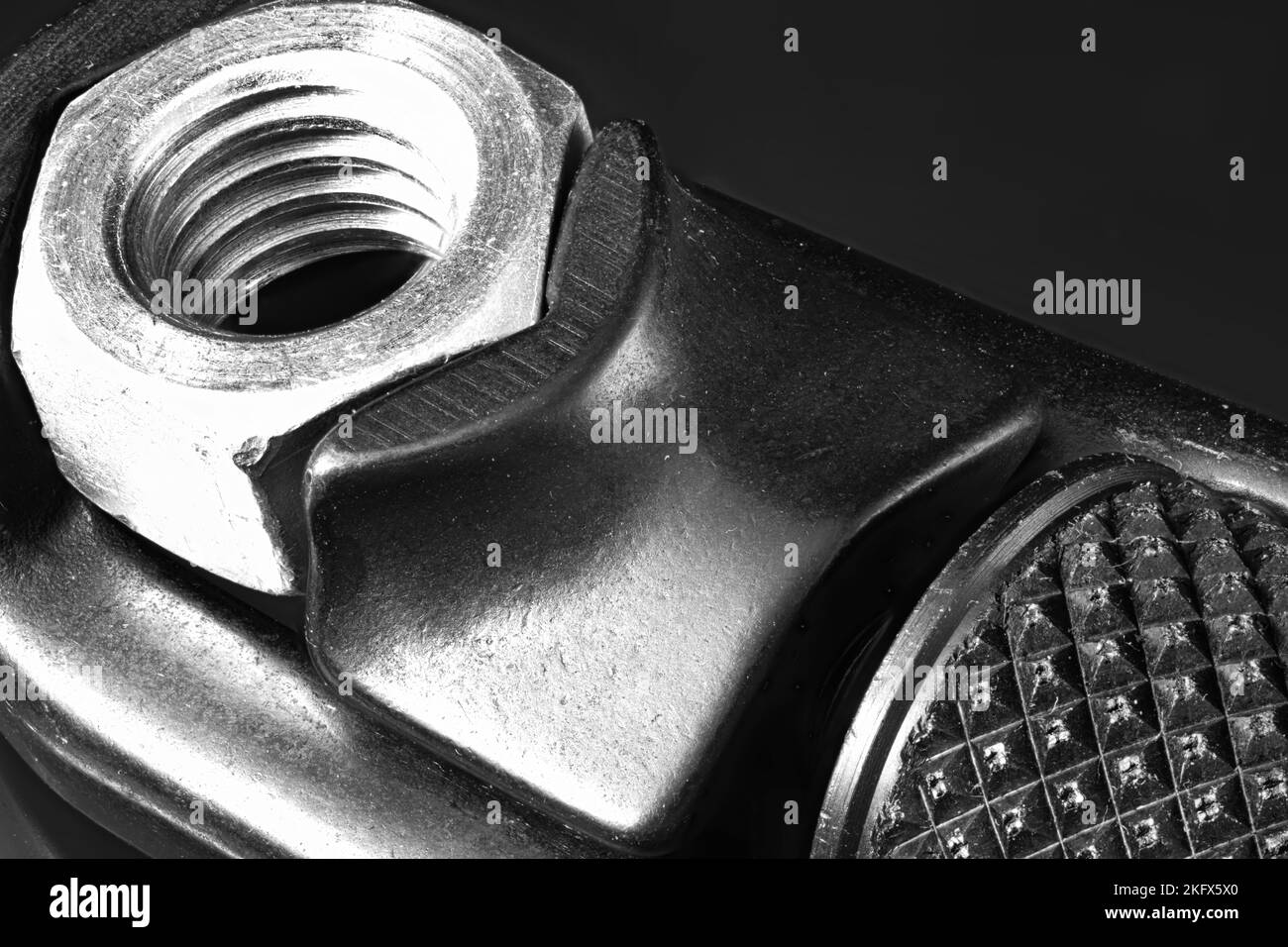 Box end Wrench and nut on dark background Stock Photo