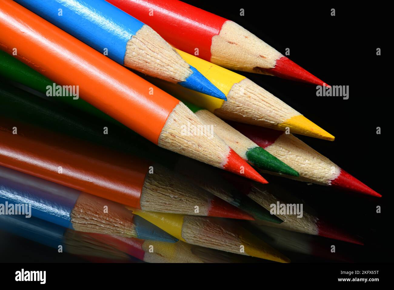 Colored Pencil Points on dark glass Stock Photo Alamy
