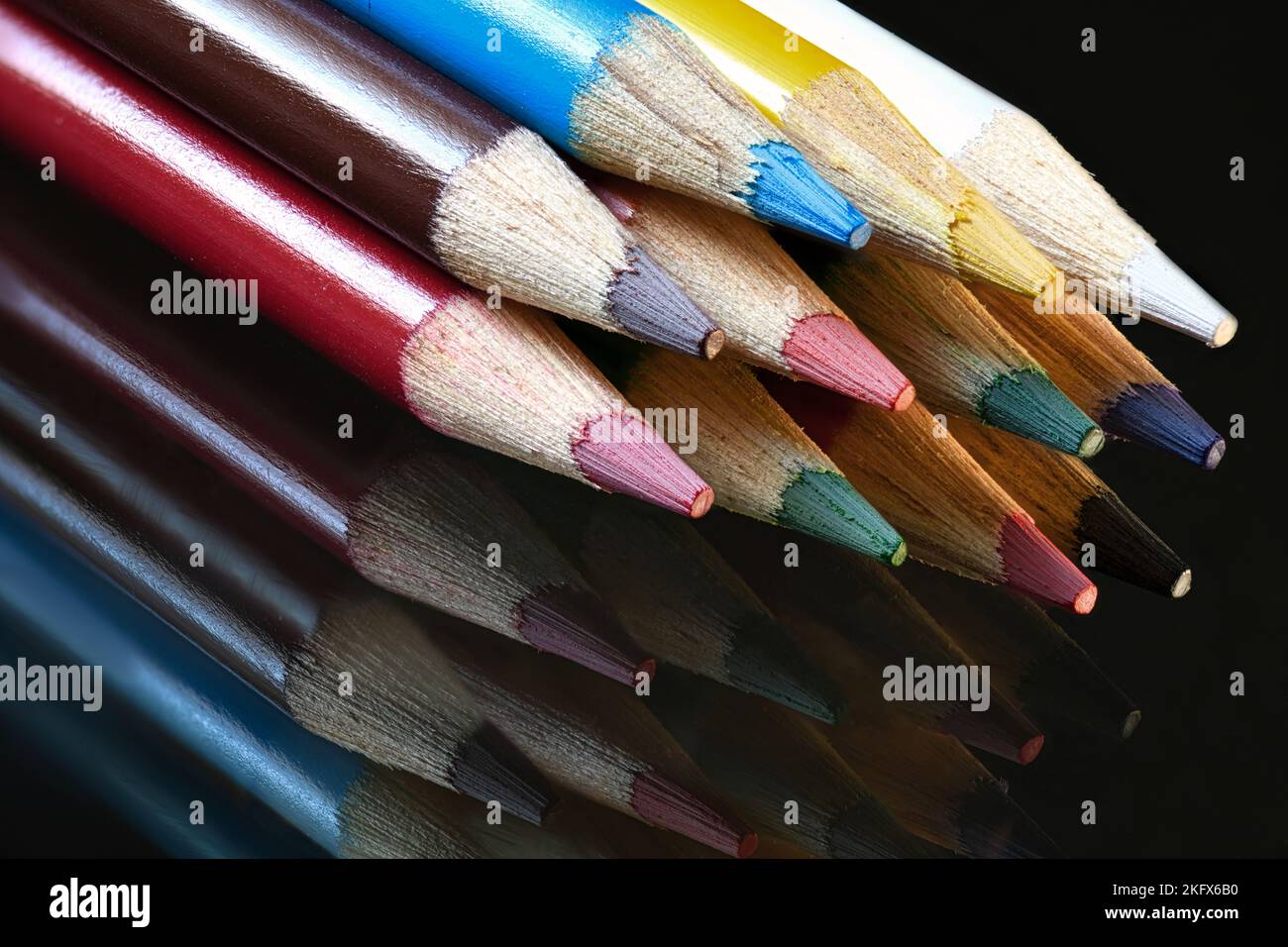 Colored Pencil Points on dark glass Stock Photo Alamy