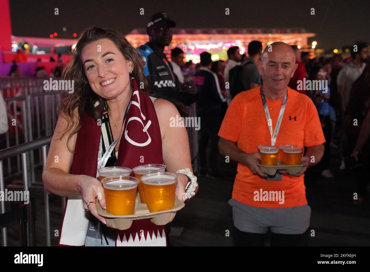 Football fans holding pints of beer at the FIFA Fan Festival in Al