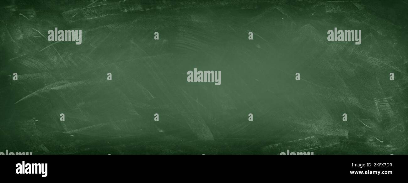 Chalk rubbed out on green chalkboard background Stock Photo