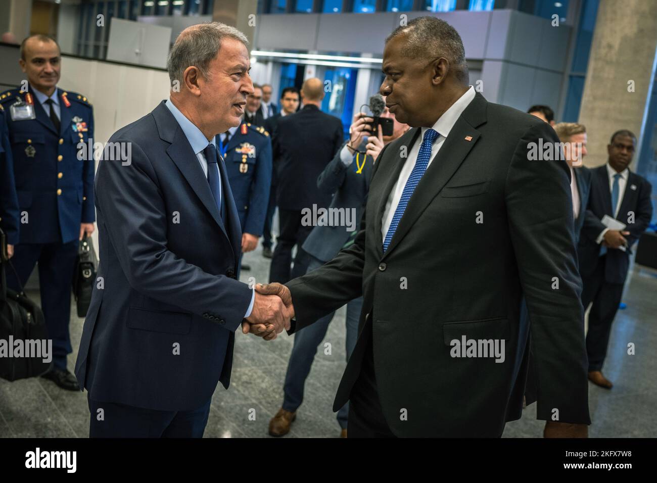 Secretary of Defense Lloyd J. Austin III greets Turkish Minister of National Defense Hulusi Akar at the NATO Defense Ministerial in Brussels, Belgium, Oct. 13, 2022. Austin met with NATO defense leaders to discuss the implementation of decisions made at the Madrid Summit in June and steps the Alliance is taking to meet evolving security needs. Stock Photo