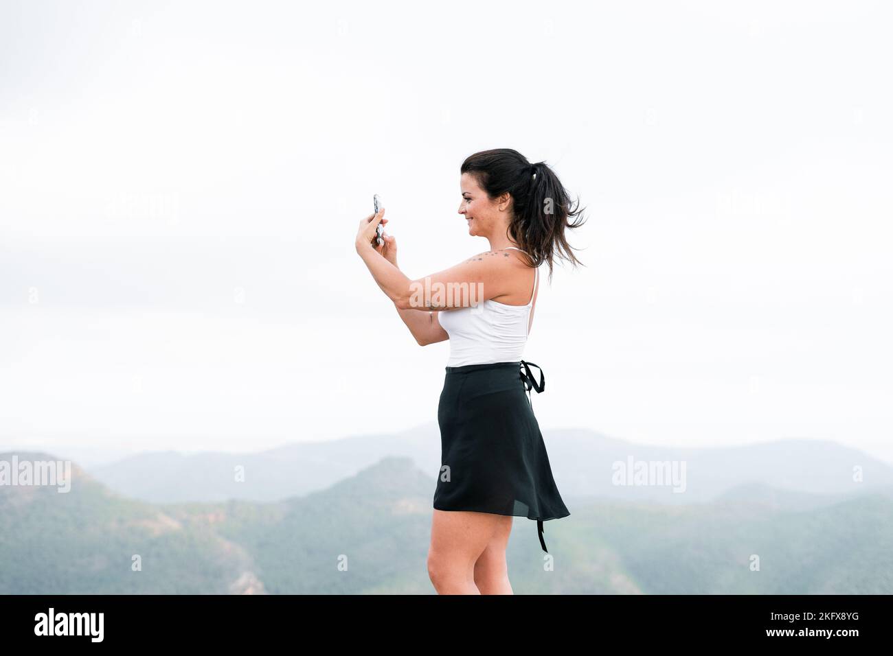 Brunette woman in skirt hi-res stock photography and images - Alamy