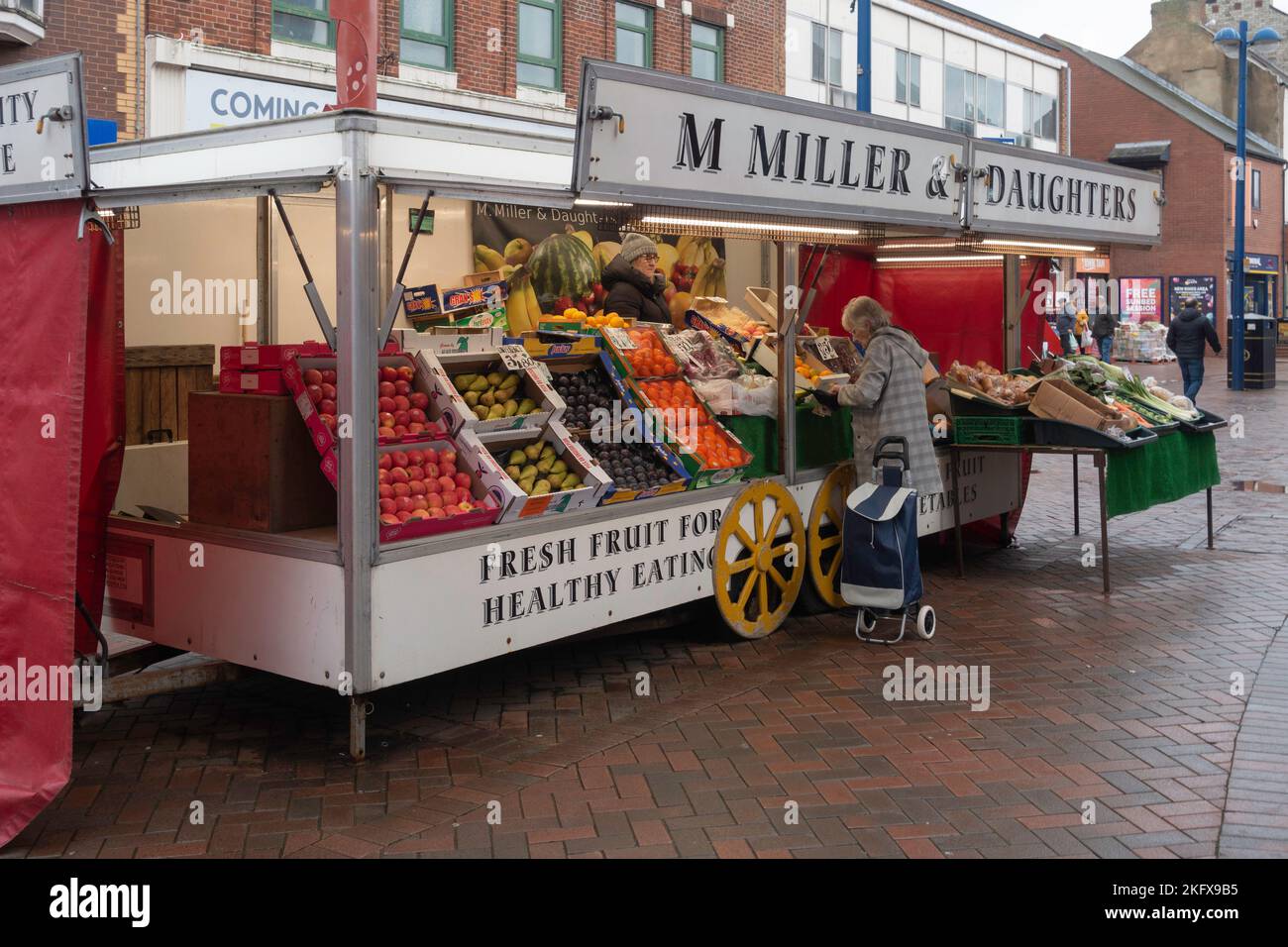 M Miller and Daughters  fruit and vegetable stall on the High Street in Autumn Redcar Cleveland Stock Photo