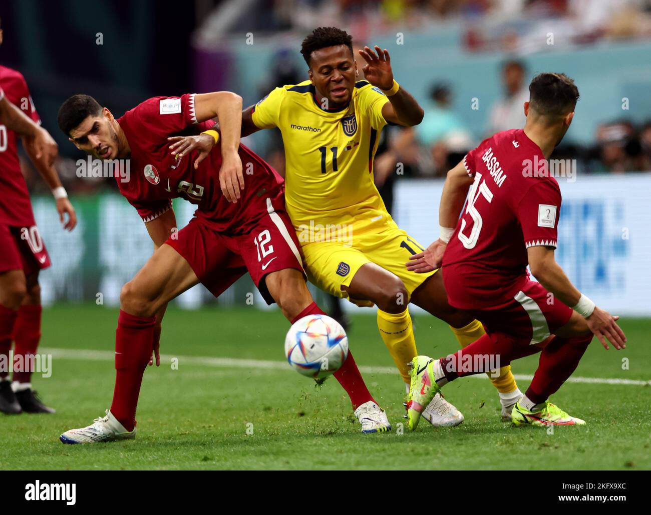 Al Khor, Qatar. 20th Nov, 2022. Karim Boudiaf of Qatar and Bassam Alrawi of Qatar combine to try and stop Michael Estrada of Equador during the FIFA World Cup 2022 match at Al Bayt Stadium, Al Khor. Picture credit should read: David Klein/Sportimage Credit: Sportimage/Alamy Live News Stock Photo