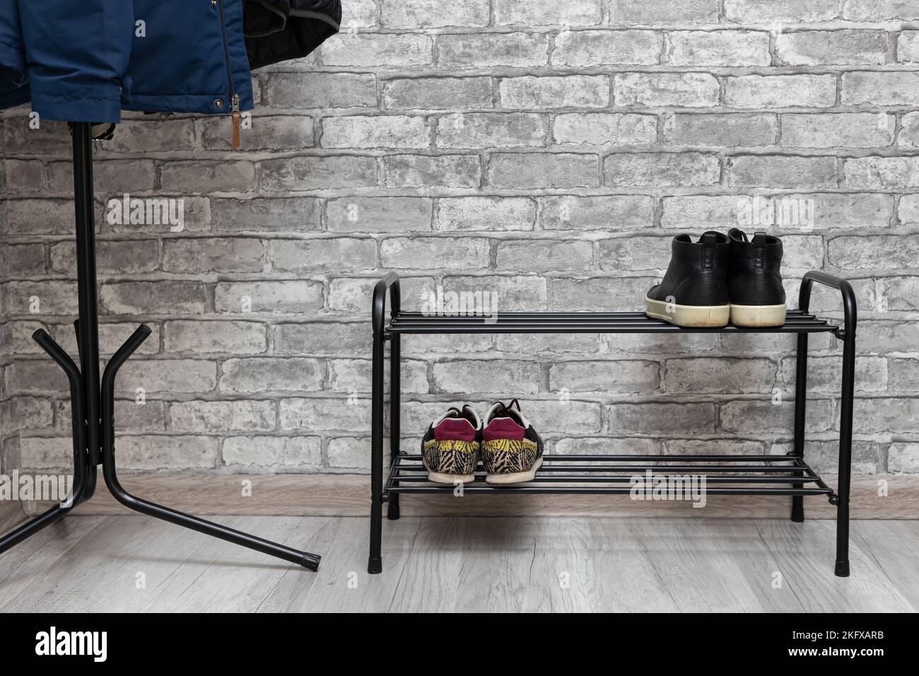 shoe rack in the hallway of the house. shoe storage. shoes on the rack