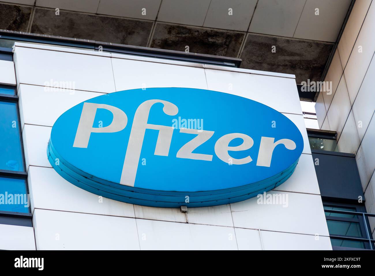 Logo sign on top of the building housing the head office of Pfizer France. Pfizer is an American pharmaceutical company present all over the world Stock Photo