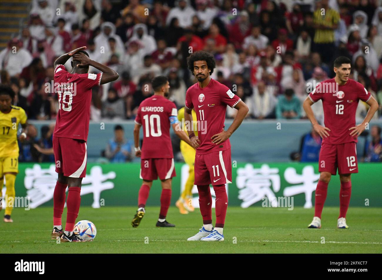 Doha, Katar. 20th Nov, 2022. Player Qataror after versustor, disappointed, frustrated, dejected, action. From left: ALMOEZ ALI (Qatar), HASSAN ALHAYDOS (Qatar), AKRAM AFIF (Qatar), KARIM BOUDIAF (Qatar). Game 1, Group A Qatar - Ecuador, on 20/11/2022, Al Bayt Stadium. Soccer World Cup 20122 in Qatar from 20.11. - 18.12.2022 ? Credit: dpa/Alamy Live News Stock Photo
