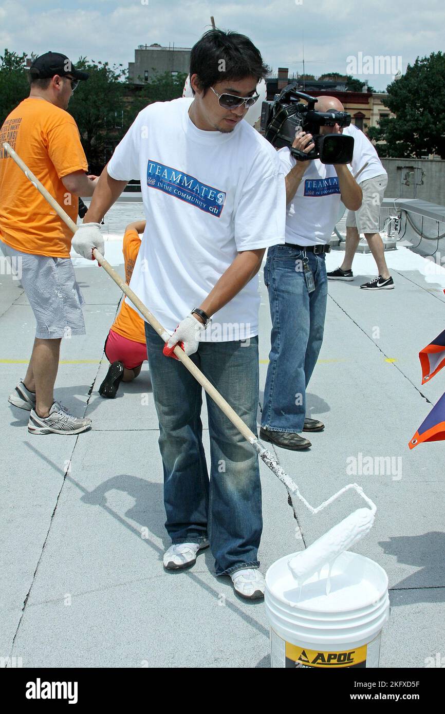 Brooklyn, NY, USA. 23 June, 2010. Hisanori Takahashi, of the NY Mets at the Cool The Roof Project at the Bedford-Stuyvesant YMCA. Credit: Steve Mack/Alamy Stock Photo