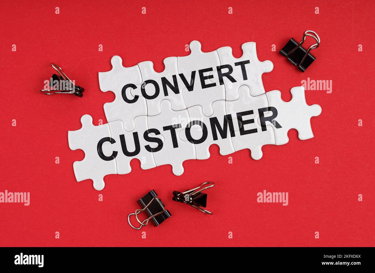 Business and Economics. On a red background, there are puzzles with the