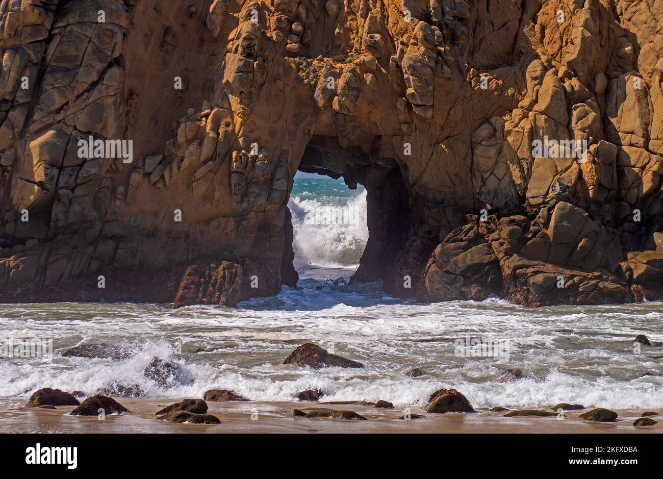 Waves Heading in an Sea Arch at Pfeiffer Beach in California Stock Photo