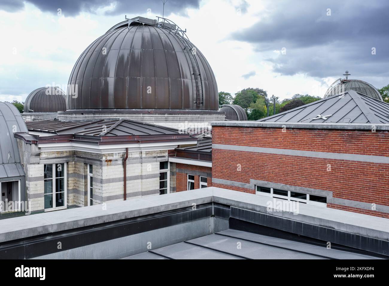 Royal Meteorogical Institute in Uccle. Telescope, dome and buildings in a park Institut royal Royal Meteorogical Institute in Uccle. Telescope, dome and buildings in a park Institut royal