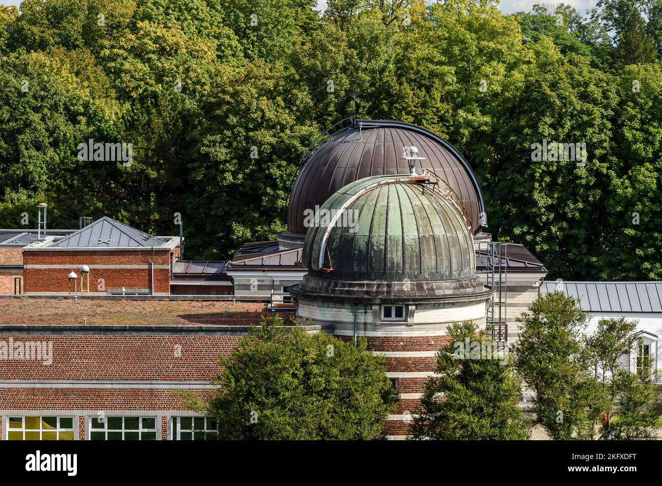 Royal Meteorogical Institute in Uccle. Telescope, dome and buildings in a park Institut royal Royal Meteorogical Institute in Uccle. Telescope, dome and buildings in a park Institut royal