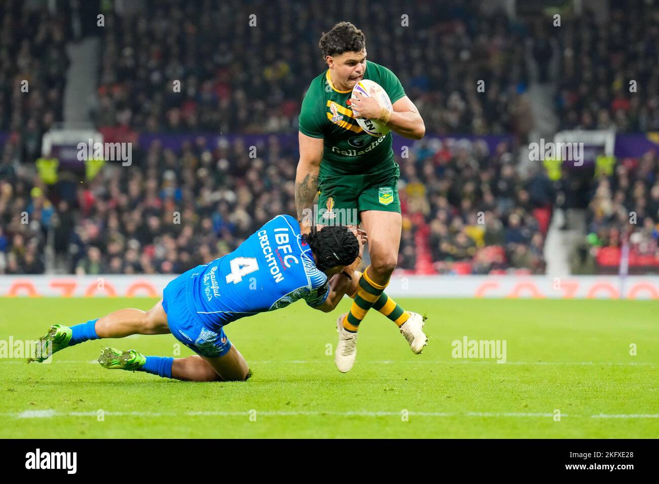 Manchester, UK. 18th Nov, 2022. Latrell Mitchell (South Sydney Rabbitohs) of Australia (8) is tackled by Stephen Crichton of Samoa (4) during the 2021 Rugby League World Cup Final 2021 match between Australia and Samoa at Old Trafford, Manchester, England on 19 November 2022. Photo by David Horn. Credit: PRiME Media Images/Alamy Live News Stock Photo