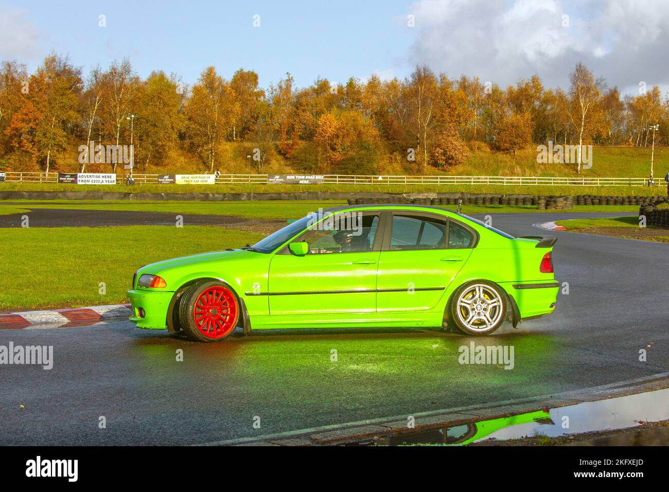 2006 Green BMW 3 Series 530D SE 2993cc Diesel 6 speed manual; Rear-wheel-drive car, driving on drift tracks and high-speed cornering on wet roads on a Three Sisters Drift Day in Wigan, UK Stock Photo