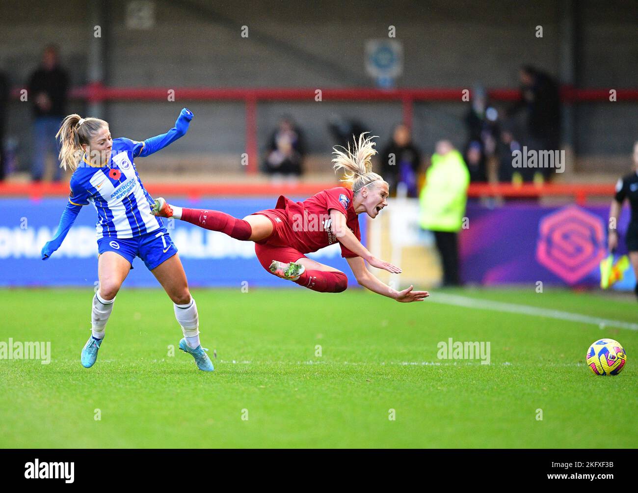 Crawley, UK. 20th Nov, 2022. Emma Koivisto of Liverpool dramatically goes to ground under pressure from Veatriki Sarri of Brighton and Hove Albion during the FA Women's Super League match between Brighton & Hove Albion Women and Liverpool Women at The People's Pension Stadium on November 20th 2022 in Crawley, United Kingdom. (Photo by Jeff Mood/phcimages.com) Credit: PHC Images/Alamy Live News Stock Photo