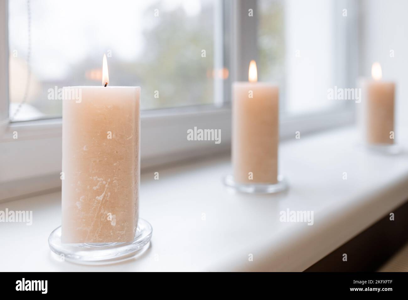SPA accessories. Scented candles on the windowsill. Stock Photo