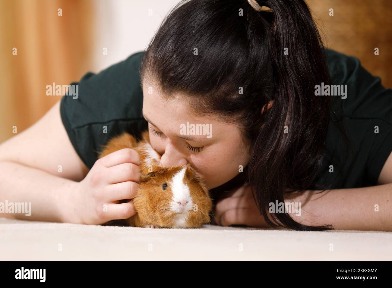young woman with guinea pig Stock Photo