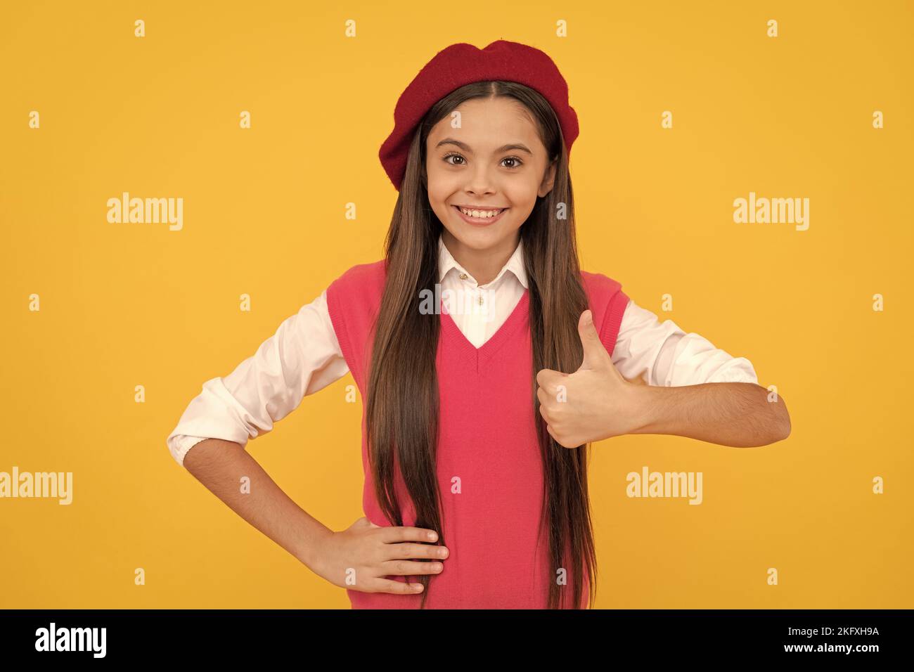 thumb up. back to school. cheerful kid in beret. smiling child has perfect style. teenage beauty Stock Photo