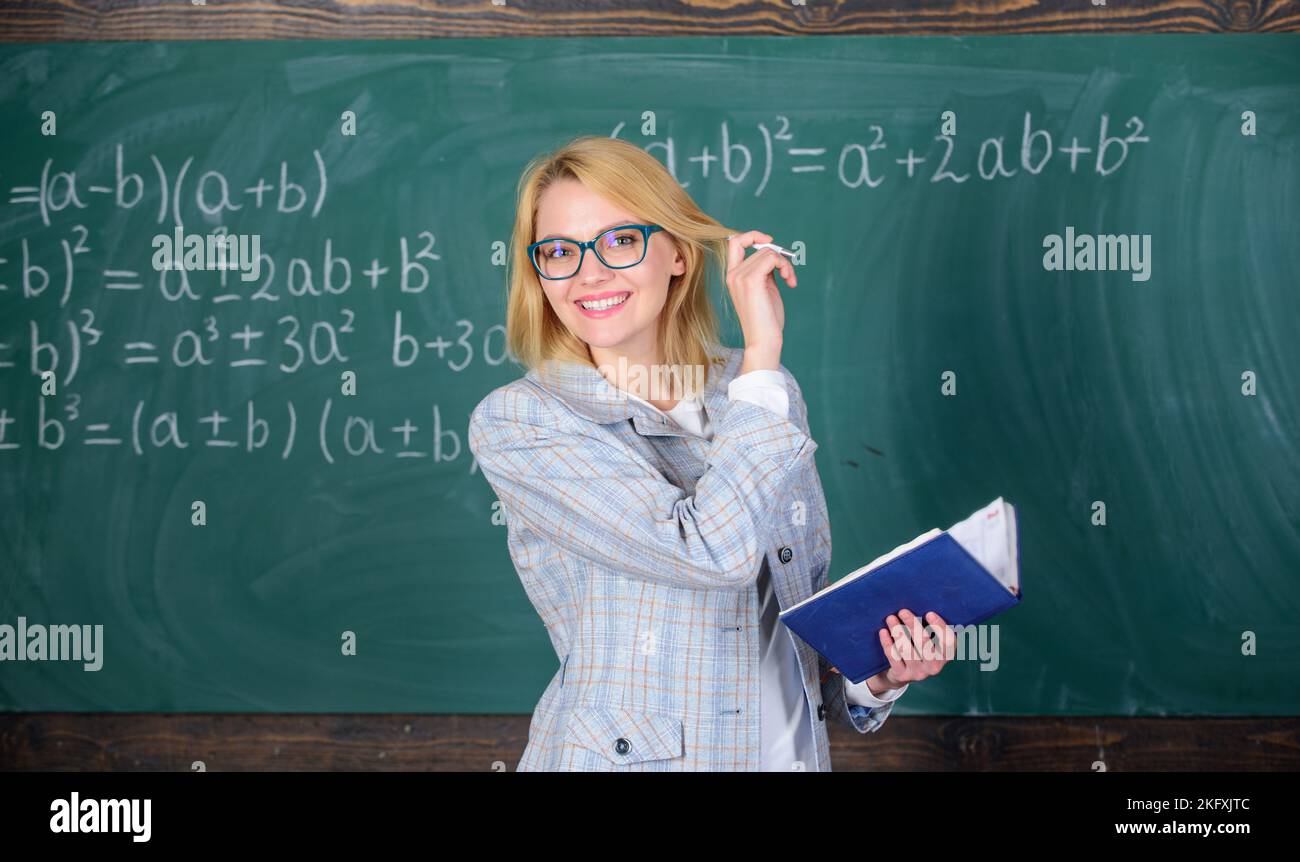 Effective teaching involve acquiring relevant knowledge about students. Qualities that make good teacher. Woman teaching near chalkboard. Principles Stock Photo