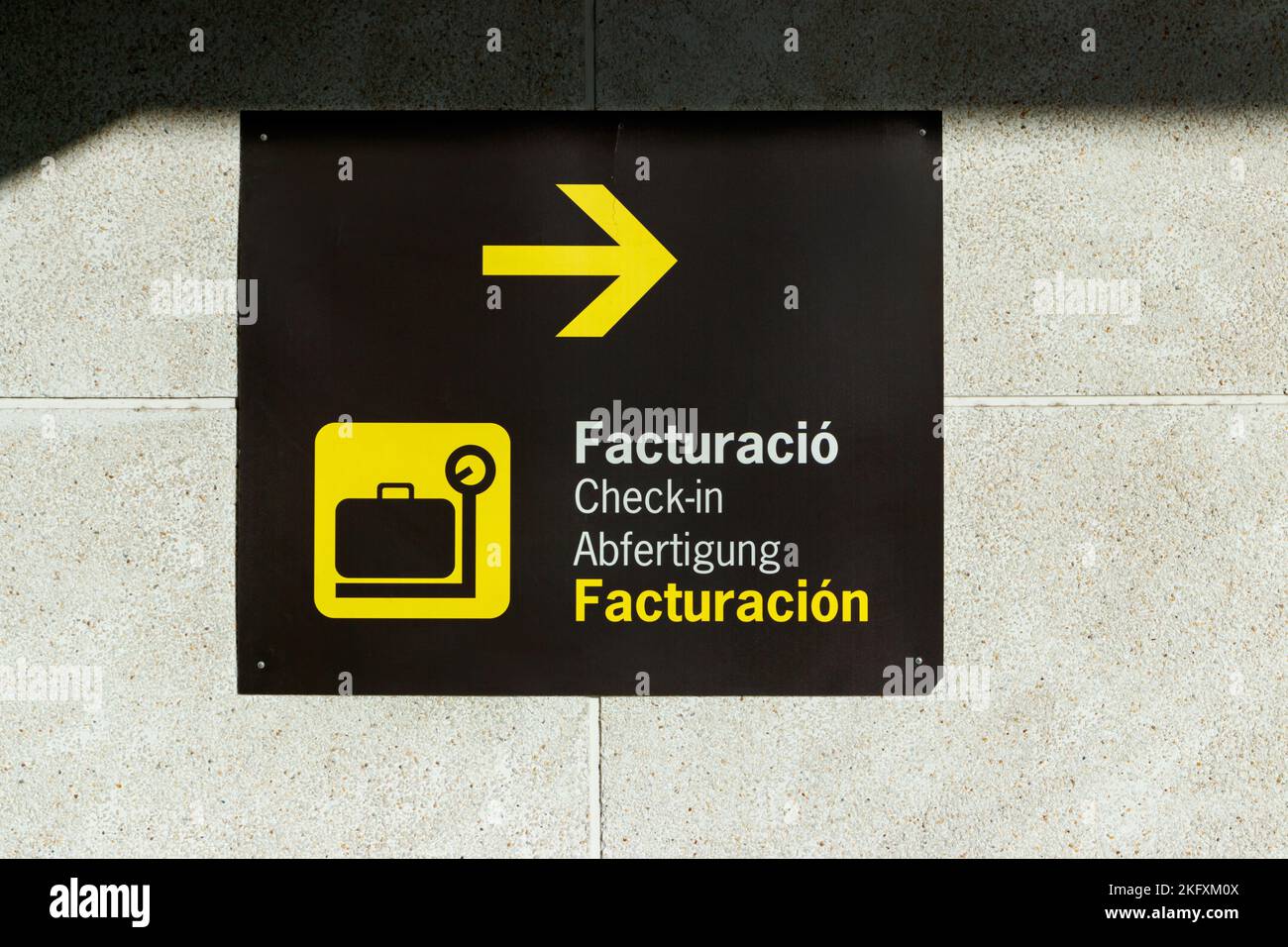 multilingual direction sign for check-in in the terminal at Palma ...