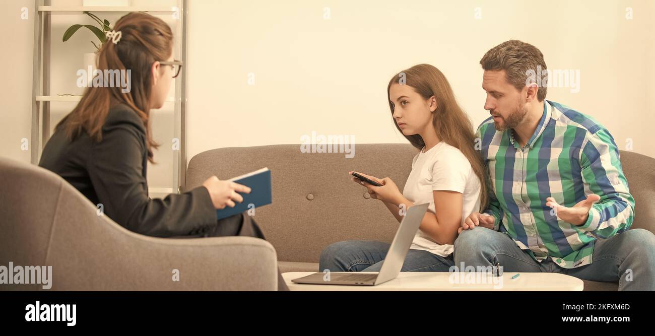 Psychologist give family therapy for dad mom and daughter girl, psychology. worried father talk to family psychologist about phone addicted child Stock Photo