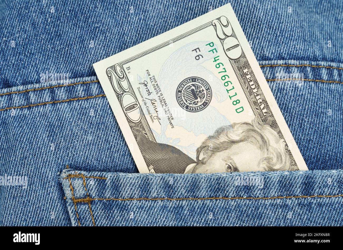 Business and finance concept. There's a twenty dollar bill in my jeans pocket. Stock Photo