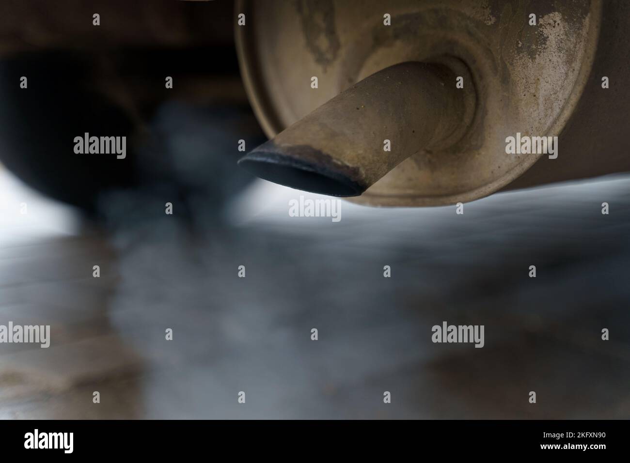 Environmental concept. Exhaust gases come out of the car's exhaust pipe