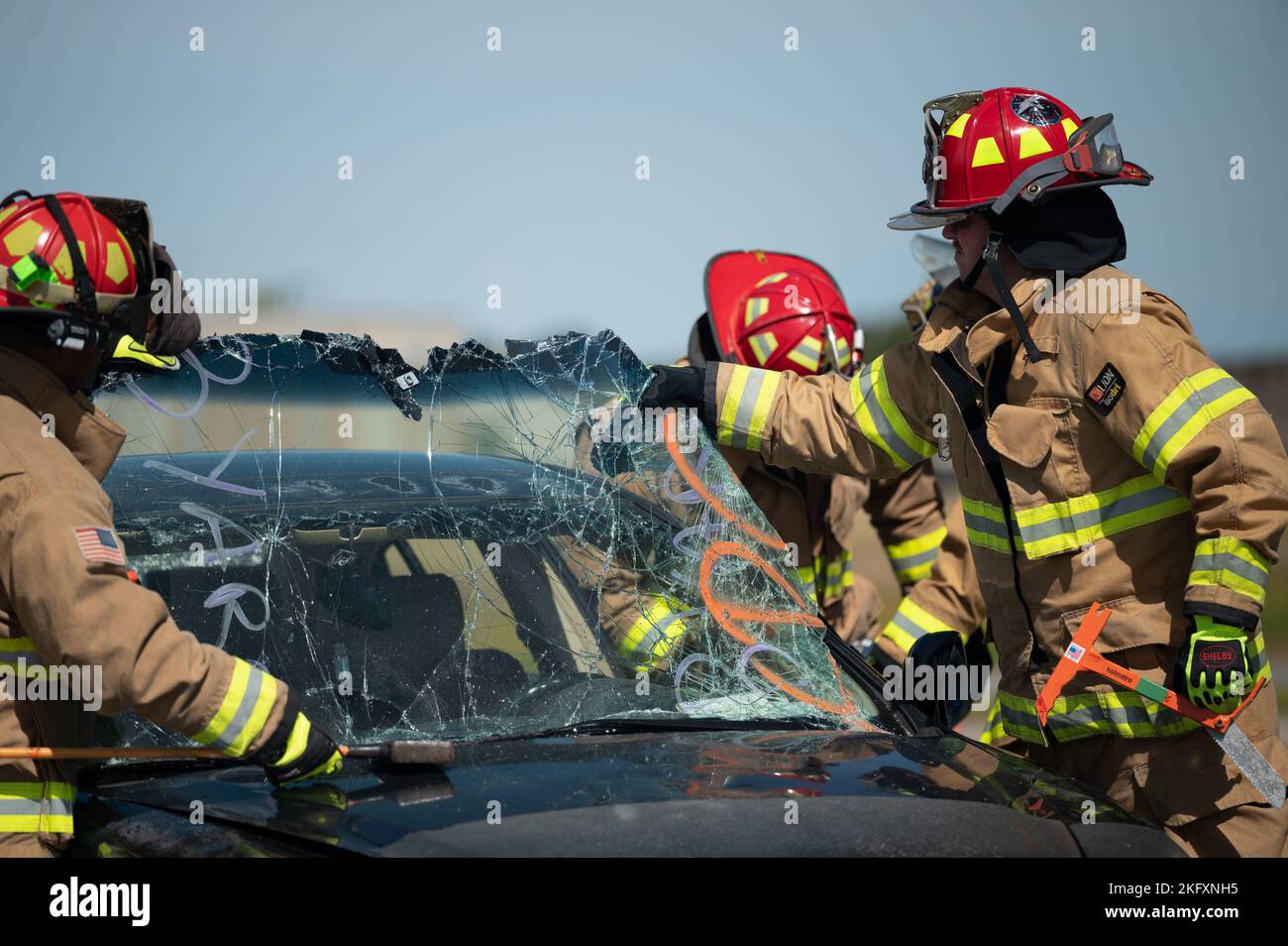 U.S. Airmen with the 325th Civil Engineer Squadron pull the windshield