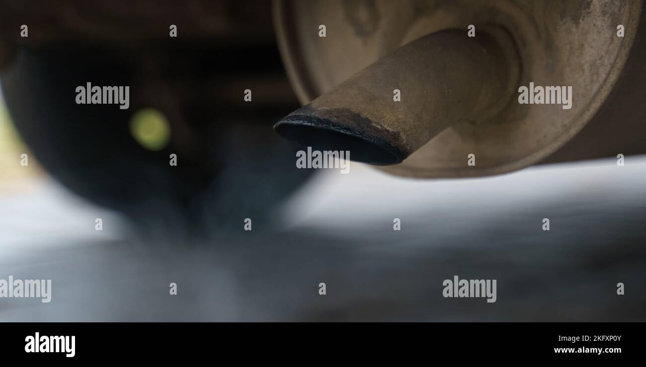 Environmental concept. Exhaust gases come out of the car's exhaust pipe