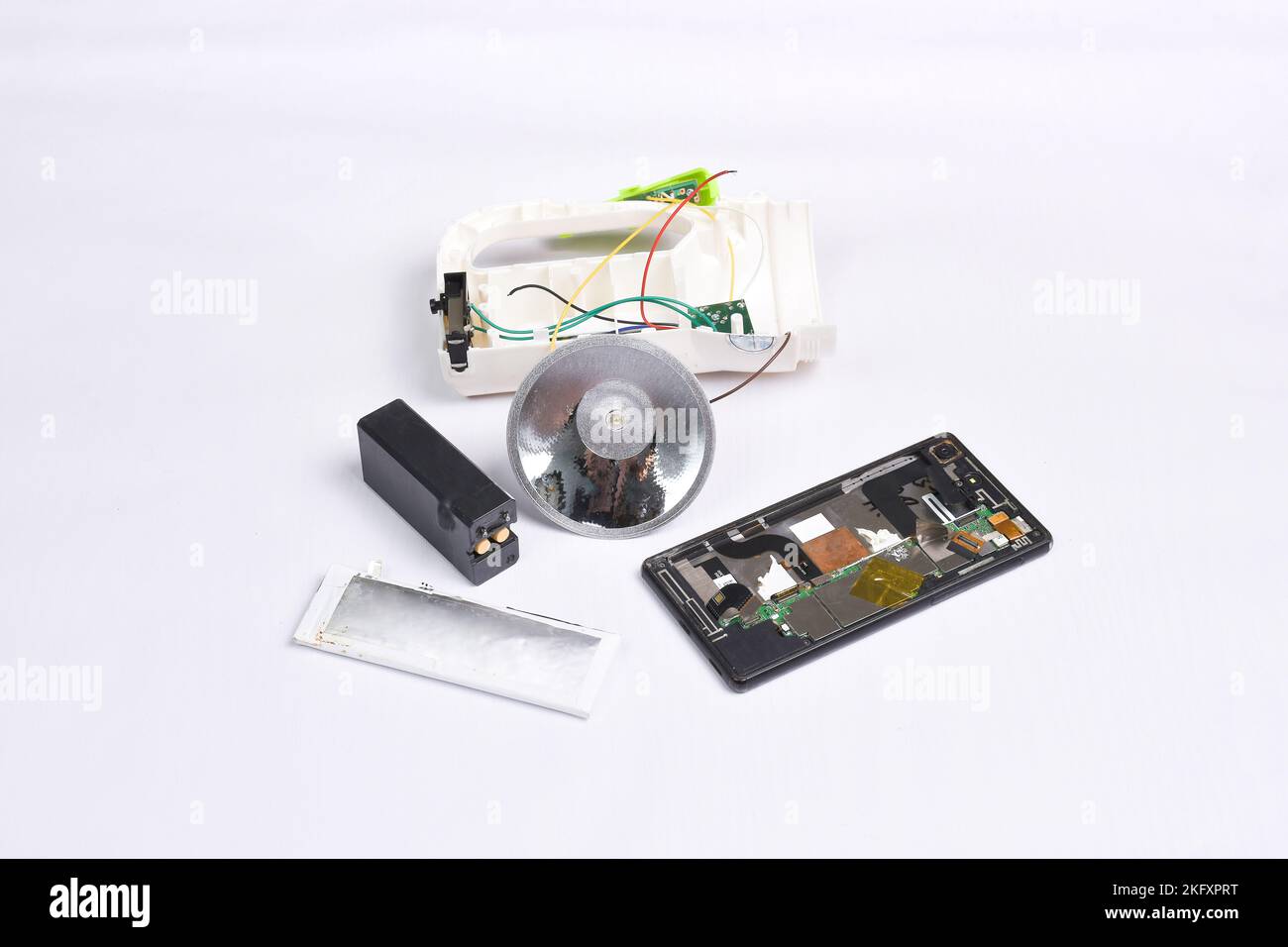 Electronics garbage for recycle on white background,battery,flashlight