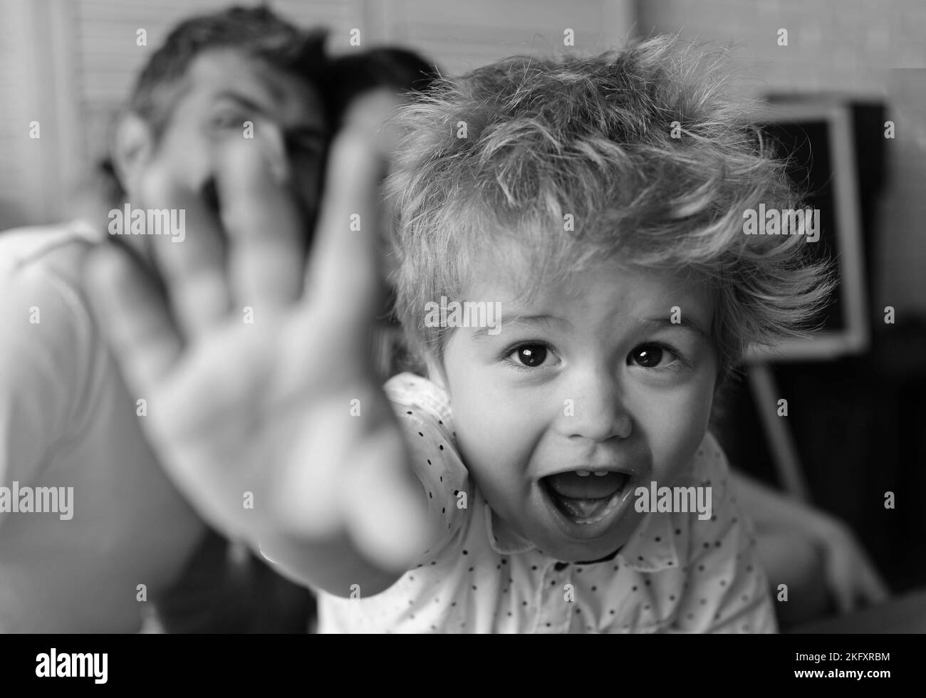 Mom, dad and boy in light room and blackboard Stock Photo Alamy