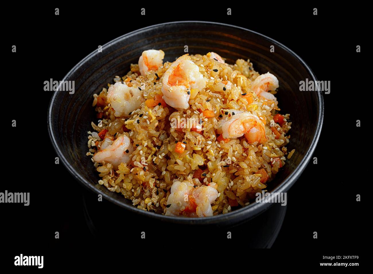 Fried rice with shrimp and sesame, on a dark background. Panasia Stock Photo