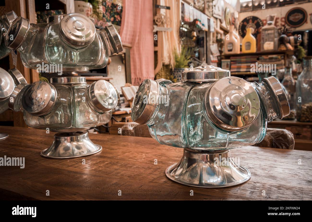 Glass candy dispenser for sale in the souvenir shop. Blurred background Stock Photo Alamy
