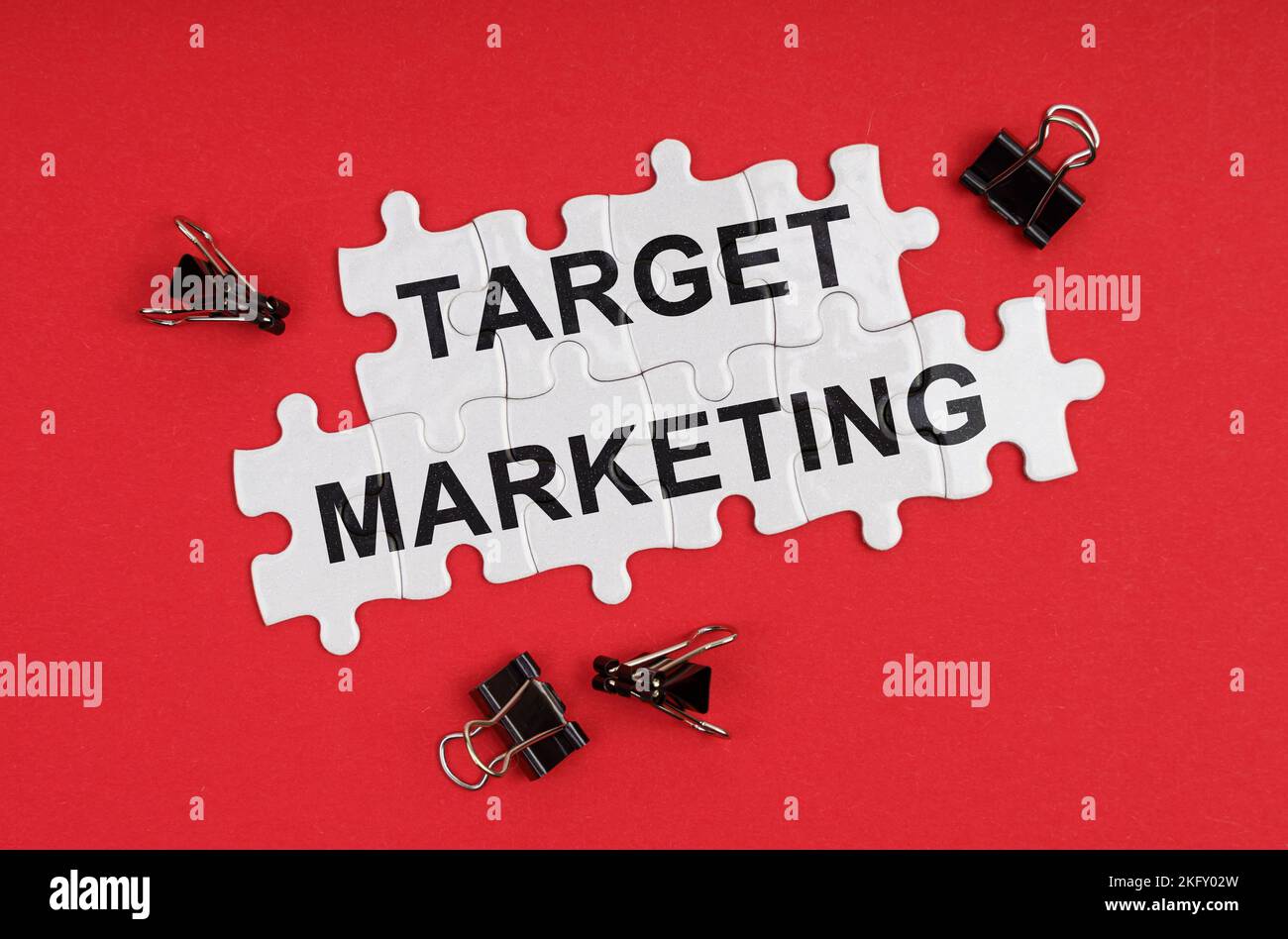 Business and Economics. On a red background, there are puzzles with the