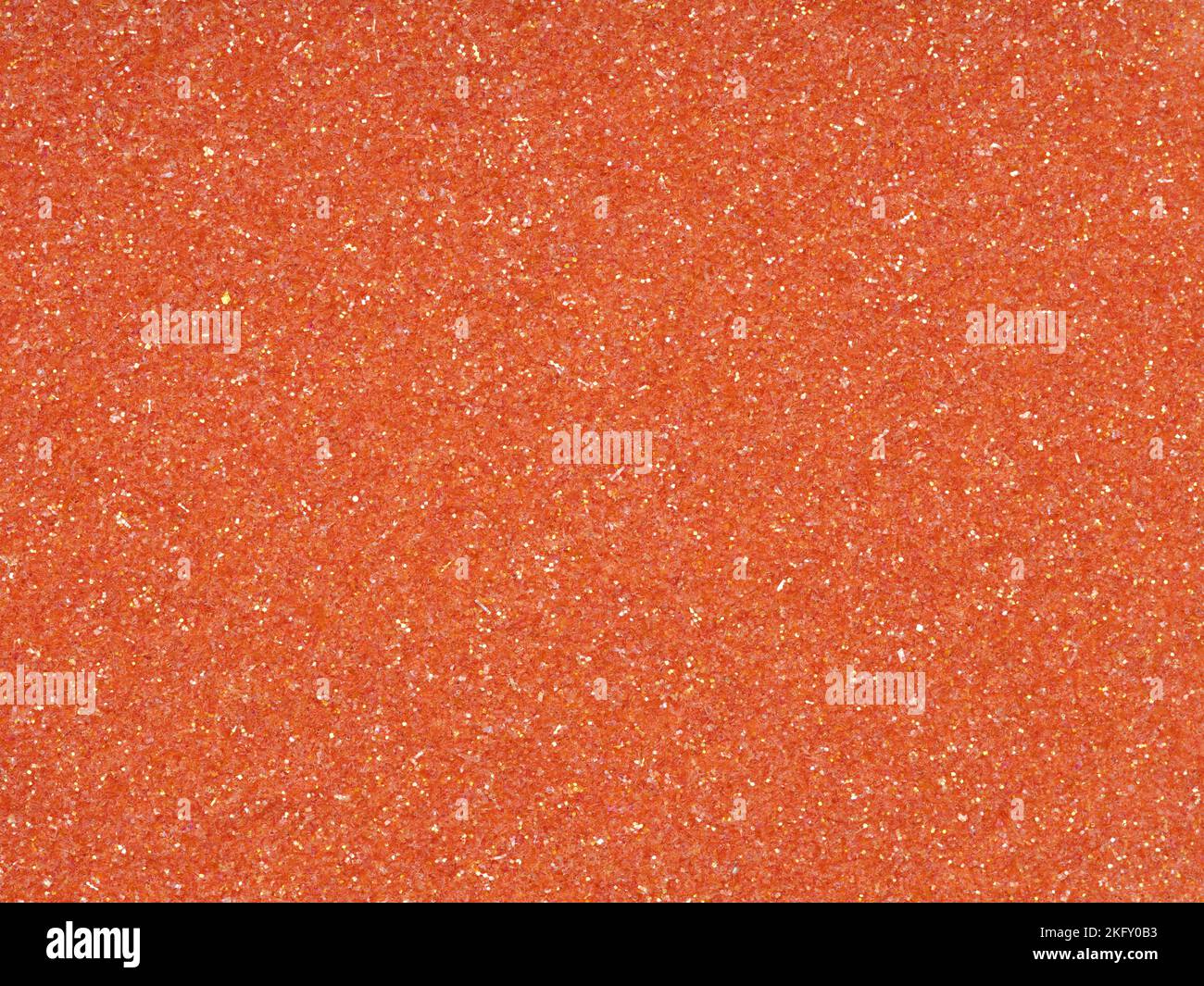 Bright soft orange holographic glitter. Abstract shiny background. Design paper texture for decoration and design of Christmas, New Year, 3d, or other Stock Photo