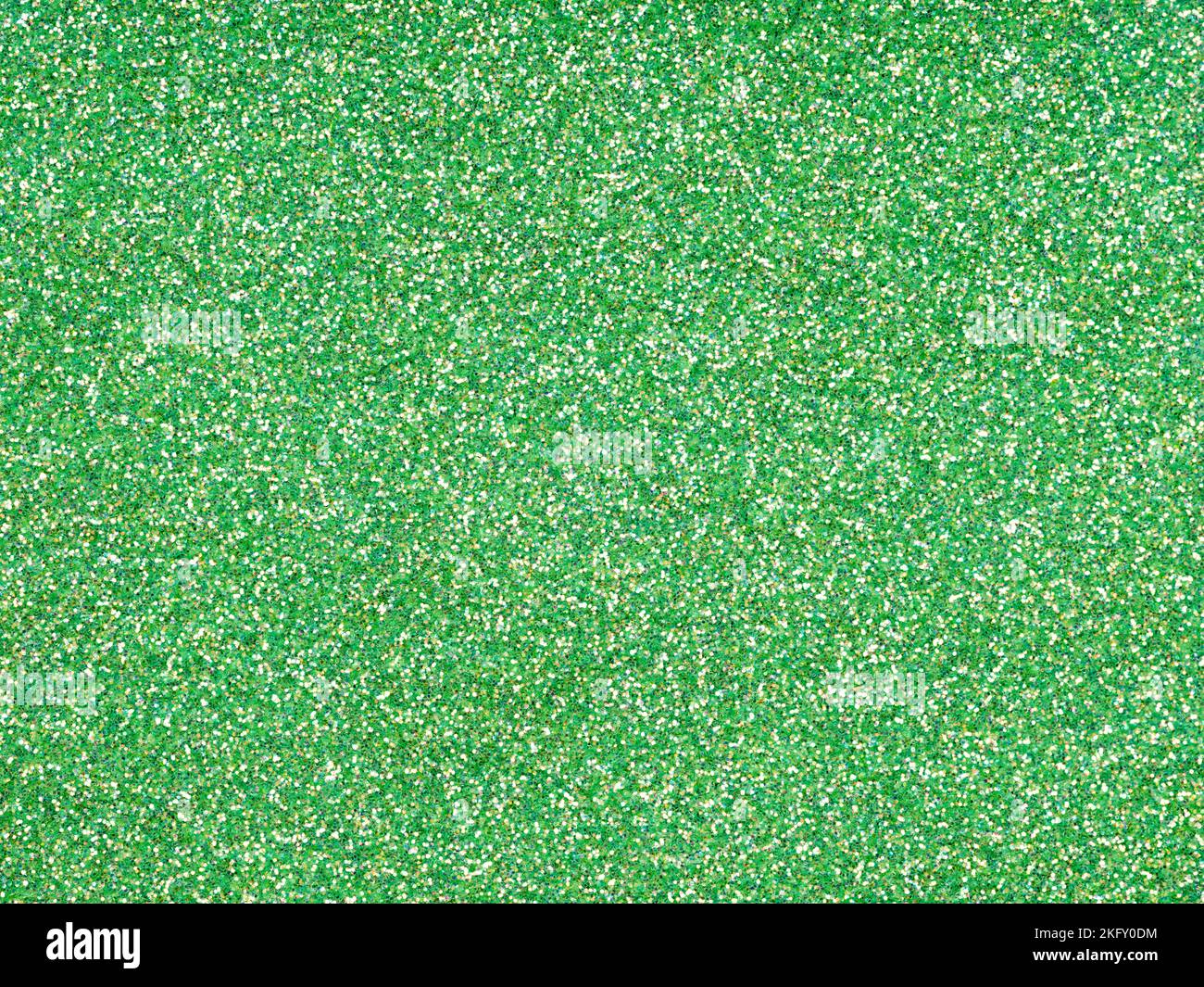 Soft green glitter. Perfect holographic background or pattern of sparkling shiny glitter for decoration and design of Christmas, New Year, Patrick Day Stock Photo