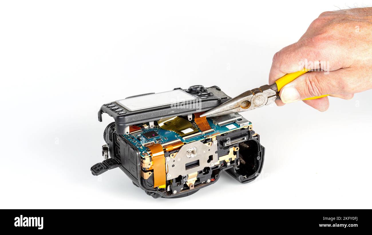 Camera repair closeup with tools and disassembly Stock Photo Alamy
