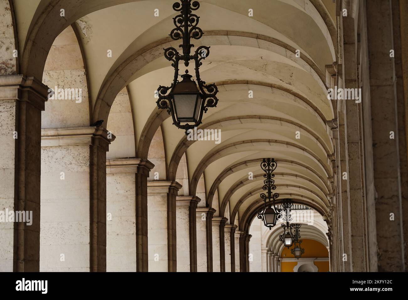 Passageway with arches forming a vaulted ceiling, with vanishing point in architecture Stock Photo