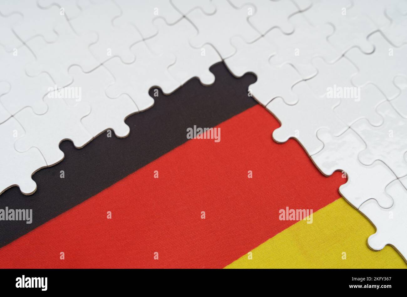 National concept. There are white puzzles on a table above the German ...