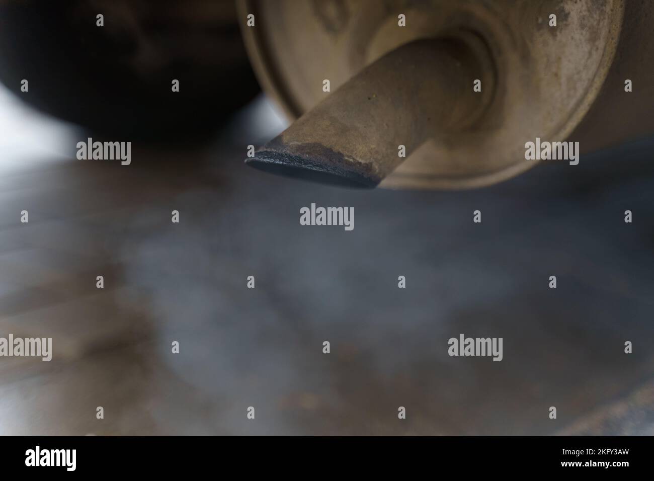 Environmental concept. Exhaust gases come out of the car's exhaust pipe