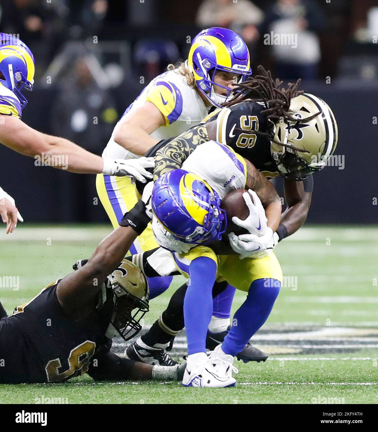 New Orleans, USA. 20th Nov, 2022. New Orleans Saints defensive tackle Albert Huggins (95) and linebacker Demario Davis (56) both tackle Los Angeles Rams running back Cam Akers (3) uring a National Football League contest at Caesars Superdome in New Orleans, Louisiana on Sunday, November 20, 2022. (Photo by Peter G. Forest/Sipa USA) Credit: Sipa USA/Alamy Live News Stock Photo