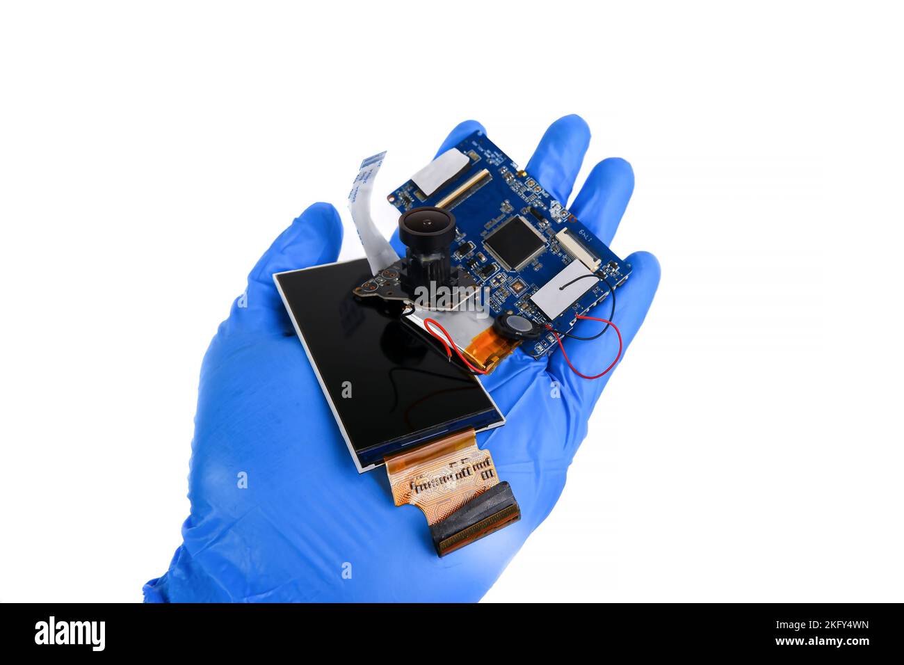 Electronics hazardous waste in a hand on white background Stock Photo