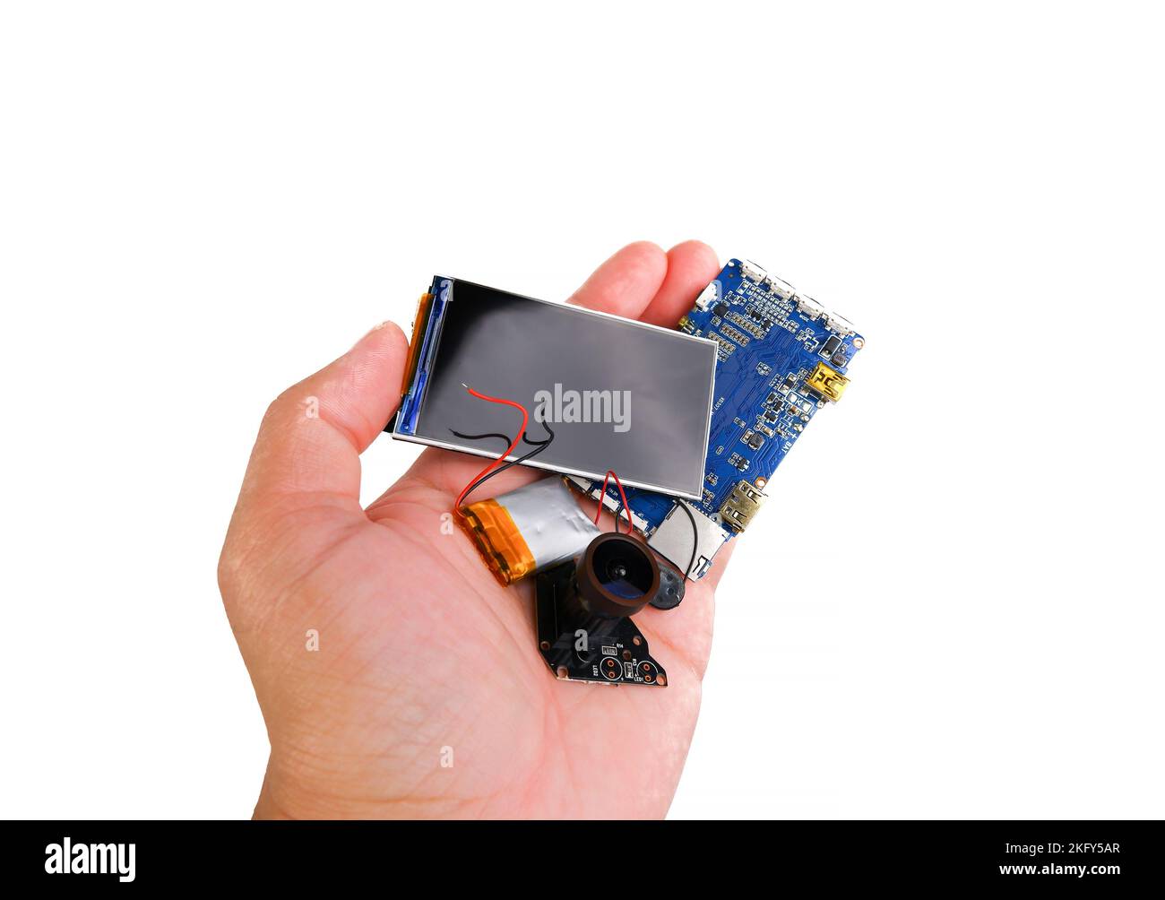 Electronics hazardous waste in a hand on white background Stock Photo
