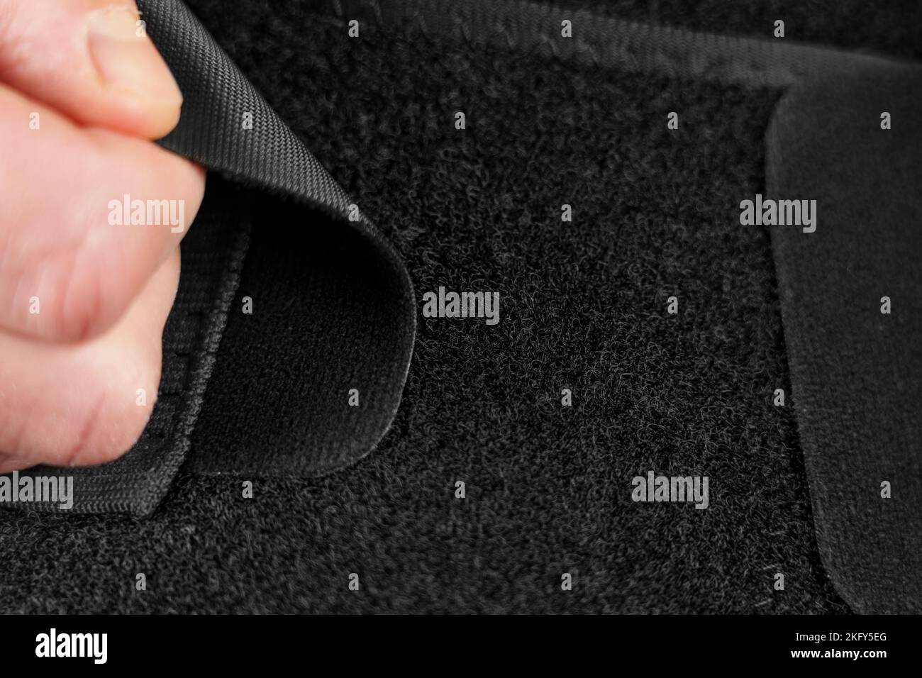 Using Velcro Attachment of the Medical Back Support Belt Stock Photo