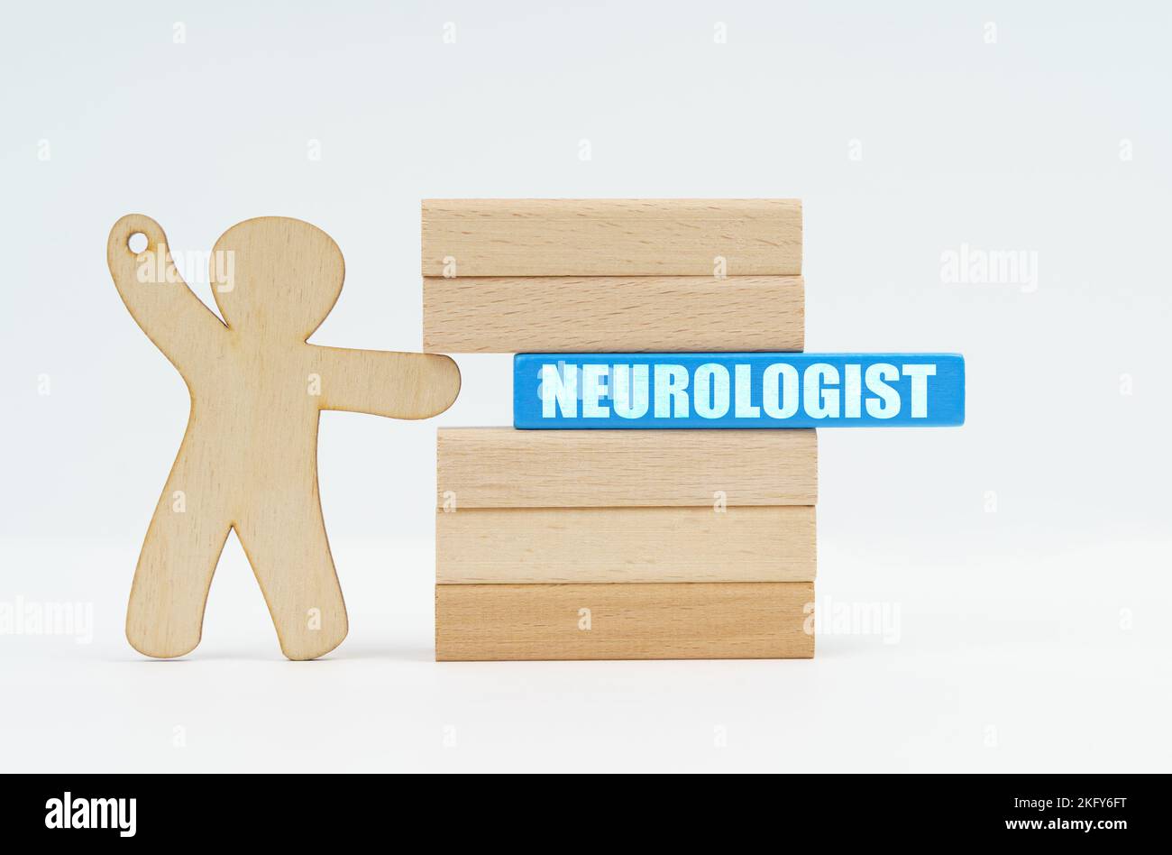 Medicine and healthcare concept. A human figurine pushes a blue wooden