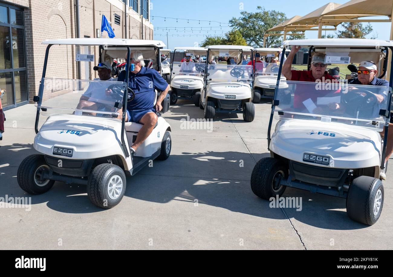 Golfers in carts make their way to the golf area during the Bay Breeze
