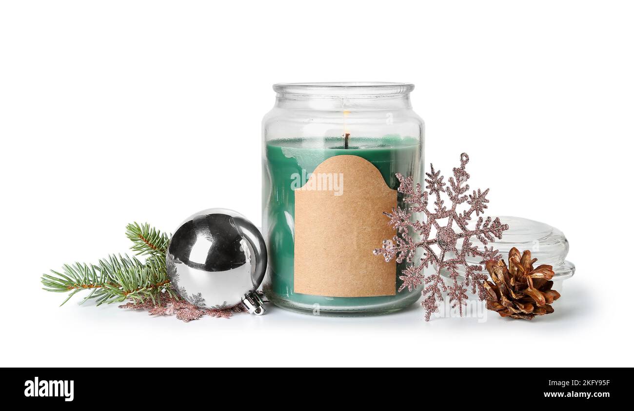 Burning candle with Christmas decor, fir branches and cone on white ...