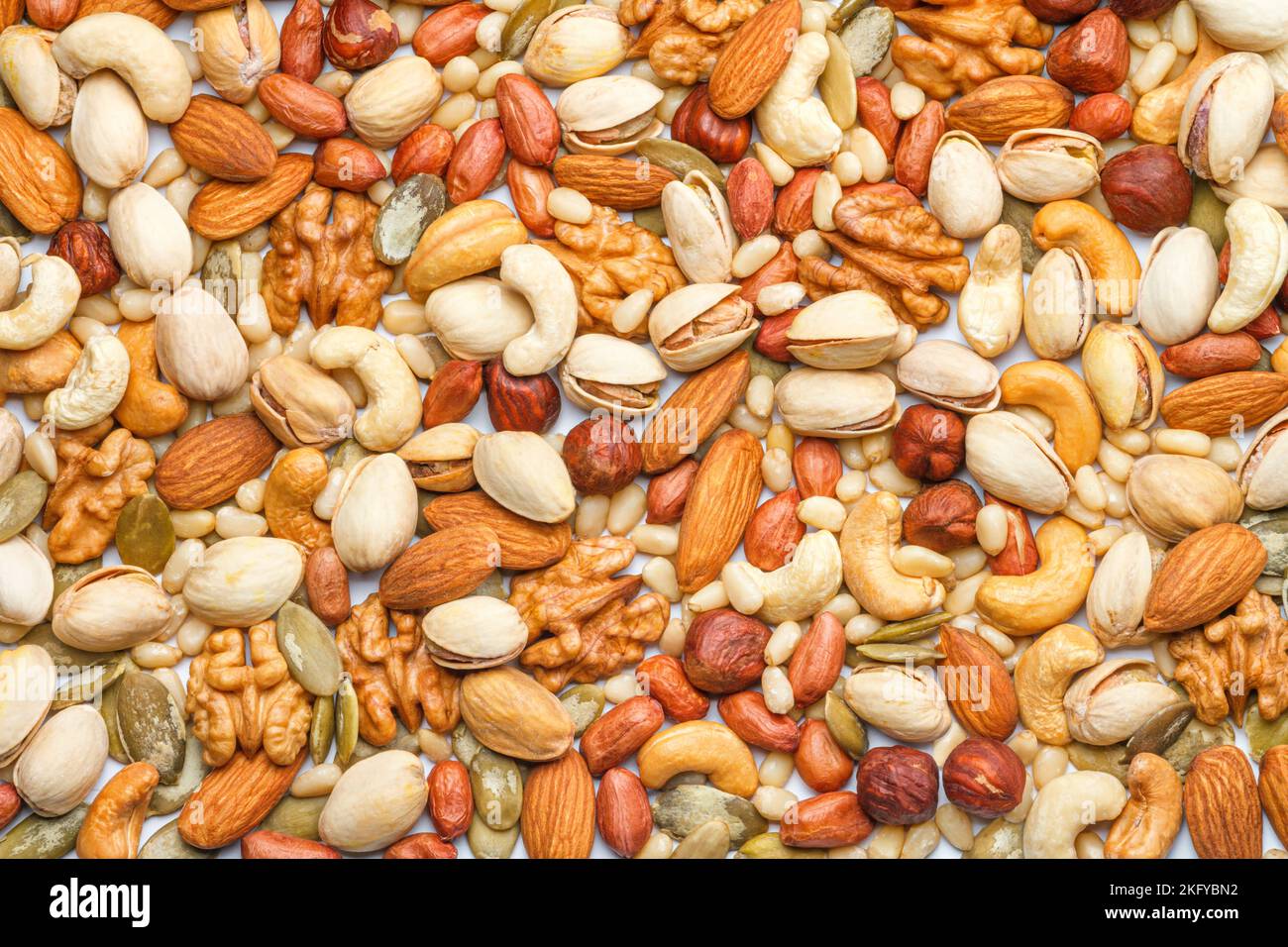 Background from different types of nuts and seeds peeled walnut