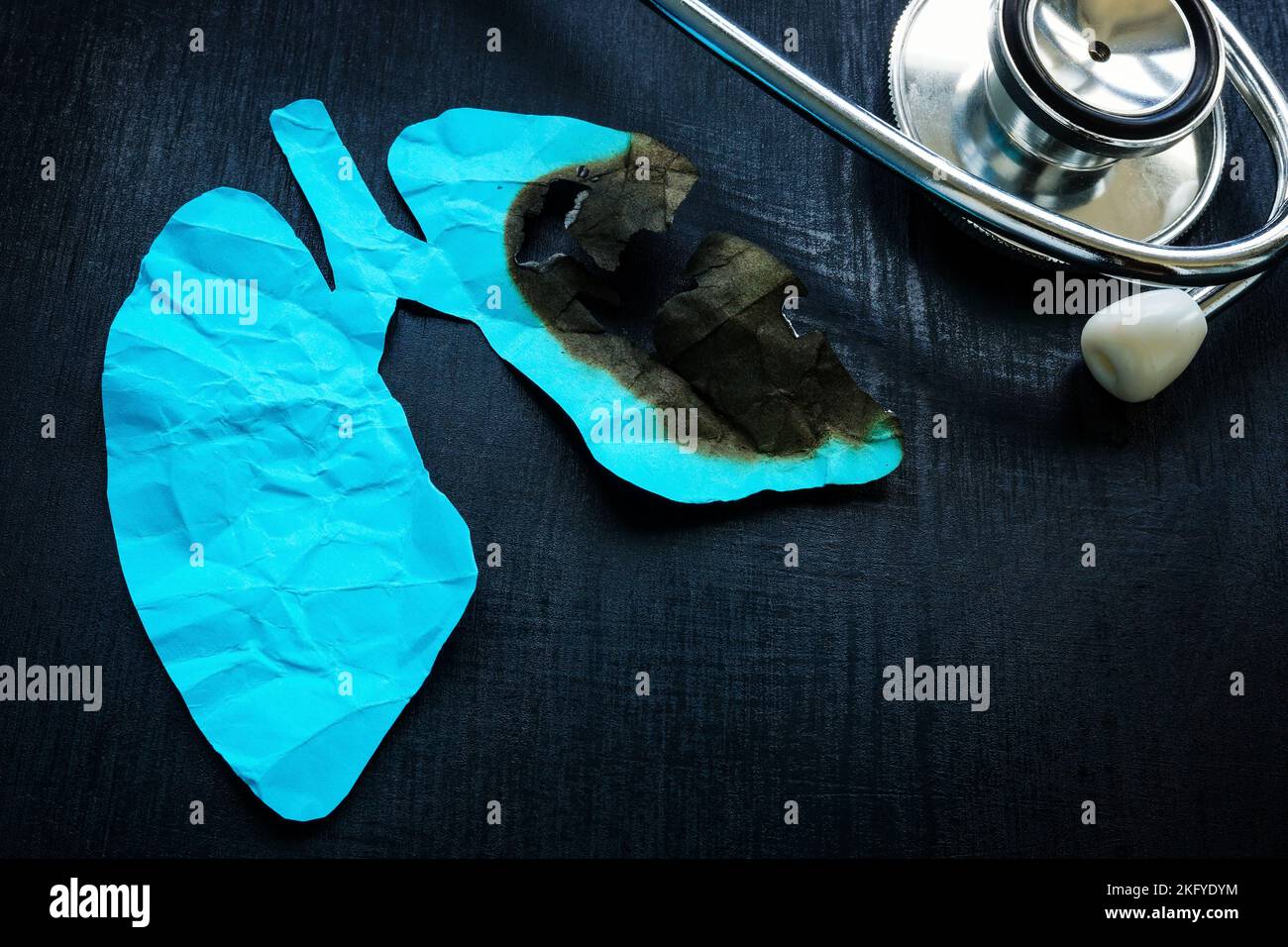 Damaged paper lungs and stethoscope. Respiratory disease concept. Stock Photo